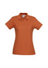 A ladies' polo shirt in a warm brown colour, featuring a collar and button placket, with a logo detail.