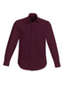 A burgundy long sleeve button-up shirt featuring a collar and a logo.