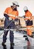Two men wearing high-visibility orange and navy workwear, including helmets, clean a surface with pressure washers.