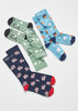 Unisex Happy Feet Comfort Socks in green with medical symbols, blue with animals, and navy with emergency vehicles.