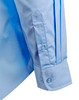 A light blue button-up shirt featuring epaulettes, with a structured sleeve and buttoned cuff. It has a logo.