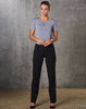 Women's low rise pants in black, paired with a grey top, standing against a textured grey background.