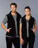 A black polar fleece vest for adults, featuring a zip-up front and side pockets, shown on a man and a woman.