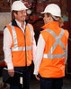 Hi-vis orange reversible safety vest featuring an X-pattern of reflective tape, worn by two individuals in hard hats.