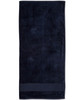 A dark navy terry velour beach towel measuring 75x150 cm, featuring a simple design and a branded logo.