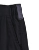 Close-up of black unisex utility stretch cargo work shorts featuring a wide waistband and a tag.