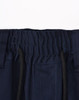 A close-up of navy blue unisex work shorts, featuring an elastic waistband and drawstring with pockets.