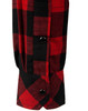A close-up of a unisex flannel shirt featuring a red and black plaid pattern with button details on the cuff.