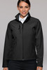 A soft shell jacket in black, featuring a zippered front and two side pockets, modelled by a woman.