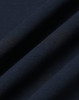 A close-up view of a navy fabric, showcasing a smooth texture with fine diagonal lines. It has a subtle sheen.