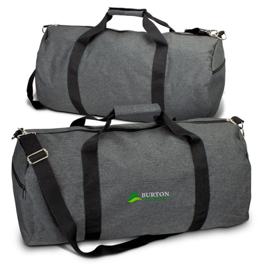 A grey duffle bag with black straps and a branding logo. The bag features a large zippered compartment.