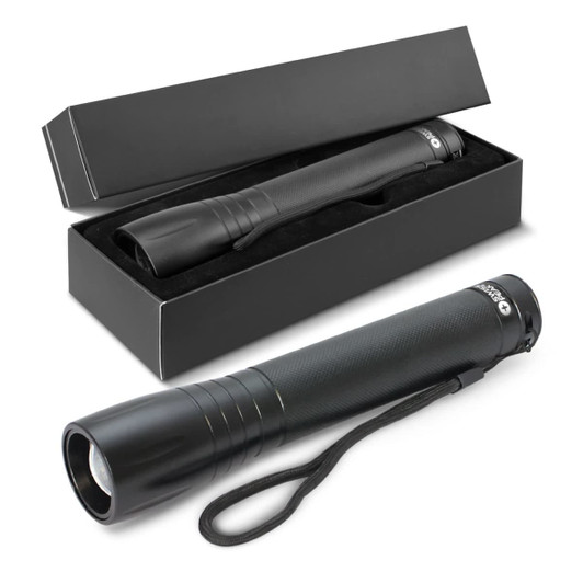 A black 10W Cree torch with a textured grip and wrist strap, positioned next to its black box packaging.
