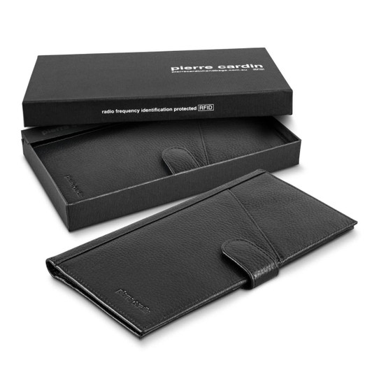 A black leather passport wallet presented in a sleek black box, featuring a branding logo.