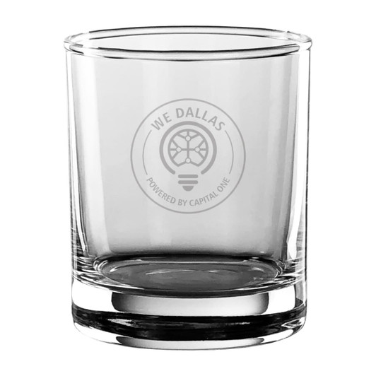 A clear glass tumbler with a thick base and a logo on the front. It has a simple, elegant design.