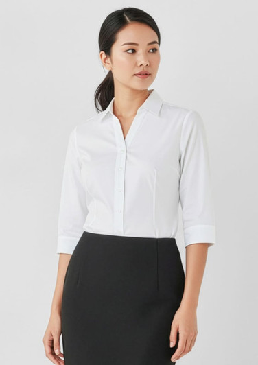 A white women's button-up shirt with 3/4 sleeves, featuring a simple and elegant design, paired with a black skirt.