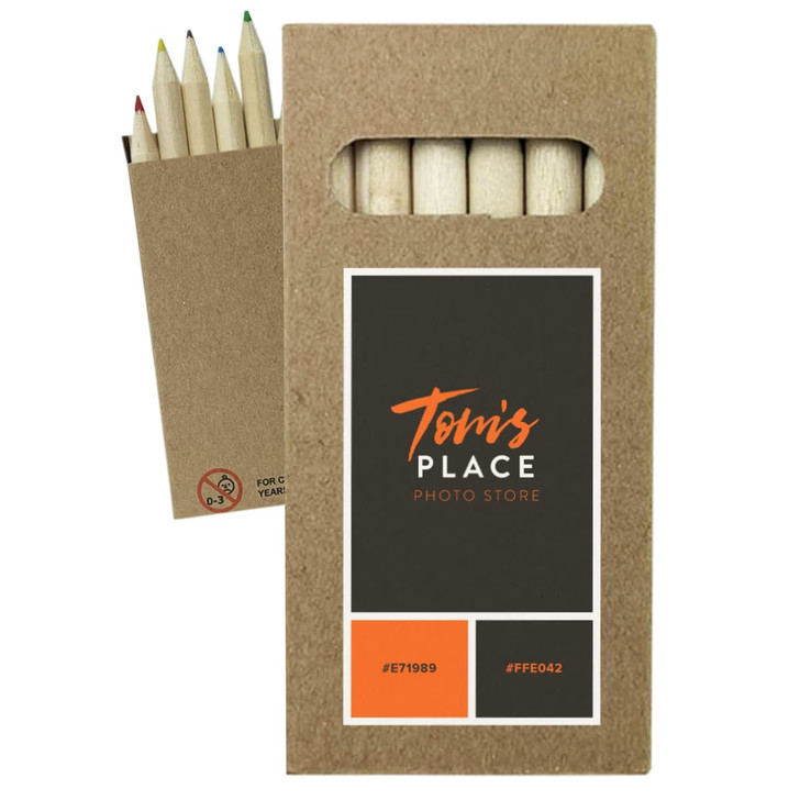 A pack of coloured pencils in a cardboard box featuring a logo and several pencil tips in varying colours.