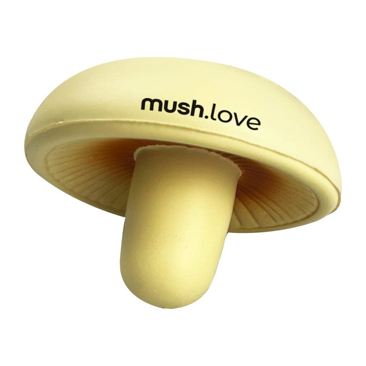 A small, yellow stress mushroom toy with a smooth surface and a logo on the side.