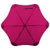 A pink BLUNT Classic Umbrella with a unique, eight-panel design and a central hub. It features a logo on the handle.