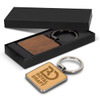 A square wooden key ring with a metal keychain, displayed in a black gift box.
