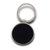 A round key ring in silver with a black centre, featuring a metallic finish.