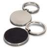 A round key ring with a polished silver finish and a black leather backing. It features a branding logo.