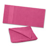 A vibrant pink Dune Beach Towel folded and laid out flat, featuring a soft, plush texture ideal for leisure activities.