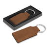 A brown leather key ring with a silver metal attachment, presented in a black gift box.