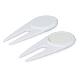 A white golf divot repairer with a built-in marker, featuring a sleek, functional design.