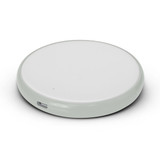 A round wireless charger in a sleek, minimal design with a smooth surface and a USB-C port.