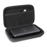 A black wireless charging power bank inside a zippered case, featuring a mesh pocket for accessories.