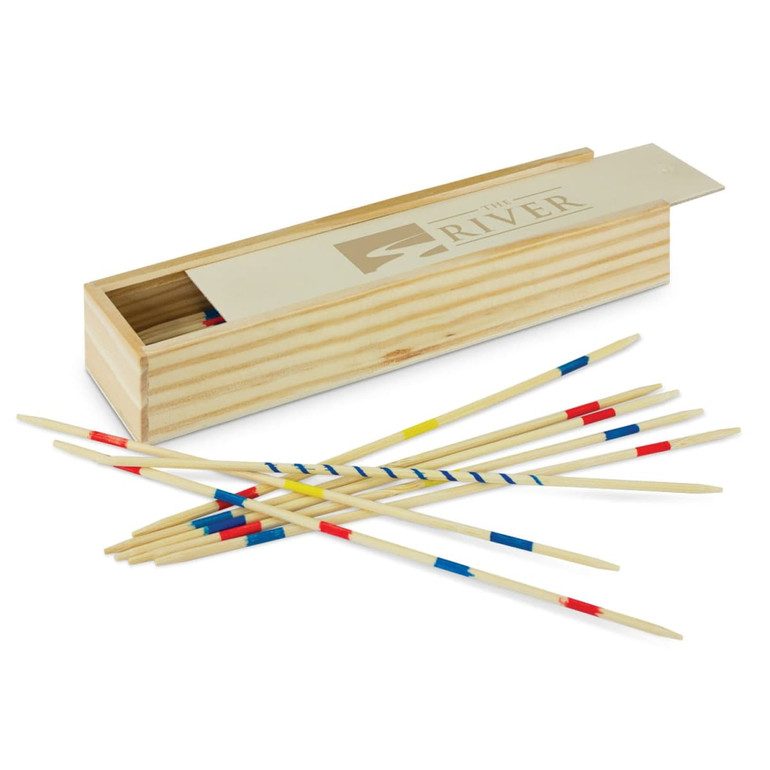 A wooden box with a lid containing coloured pick up sticks in red, blue, and yellow scattered around it.