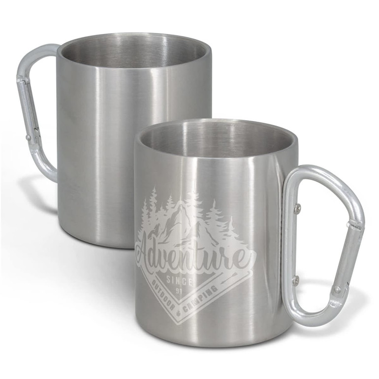 A stainless steel coffee mug with a carabiner-style handle and a logo design featuring mountains and trees.
