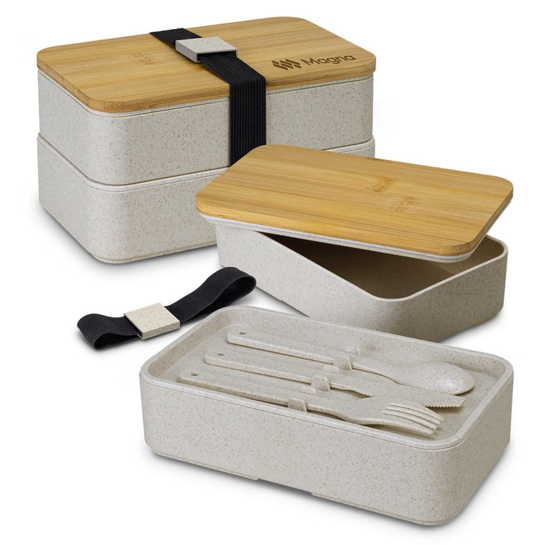 A stackable lunch box in a light beige colour with bamboo lid, featuring cutlery and a strap for secure closure.