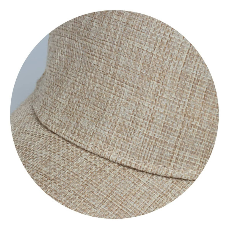 A beige cap with a textured woven design, featuring a curved brim and an integrated logo.