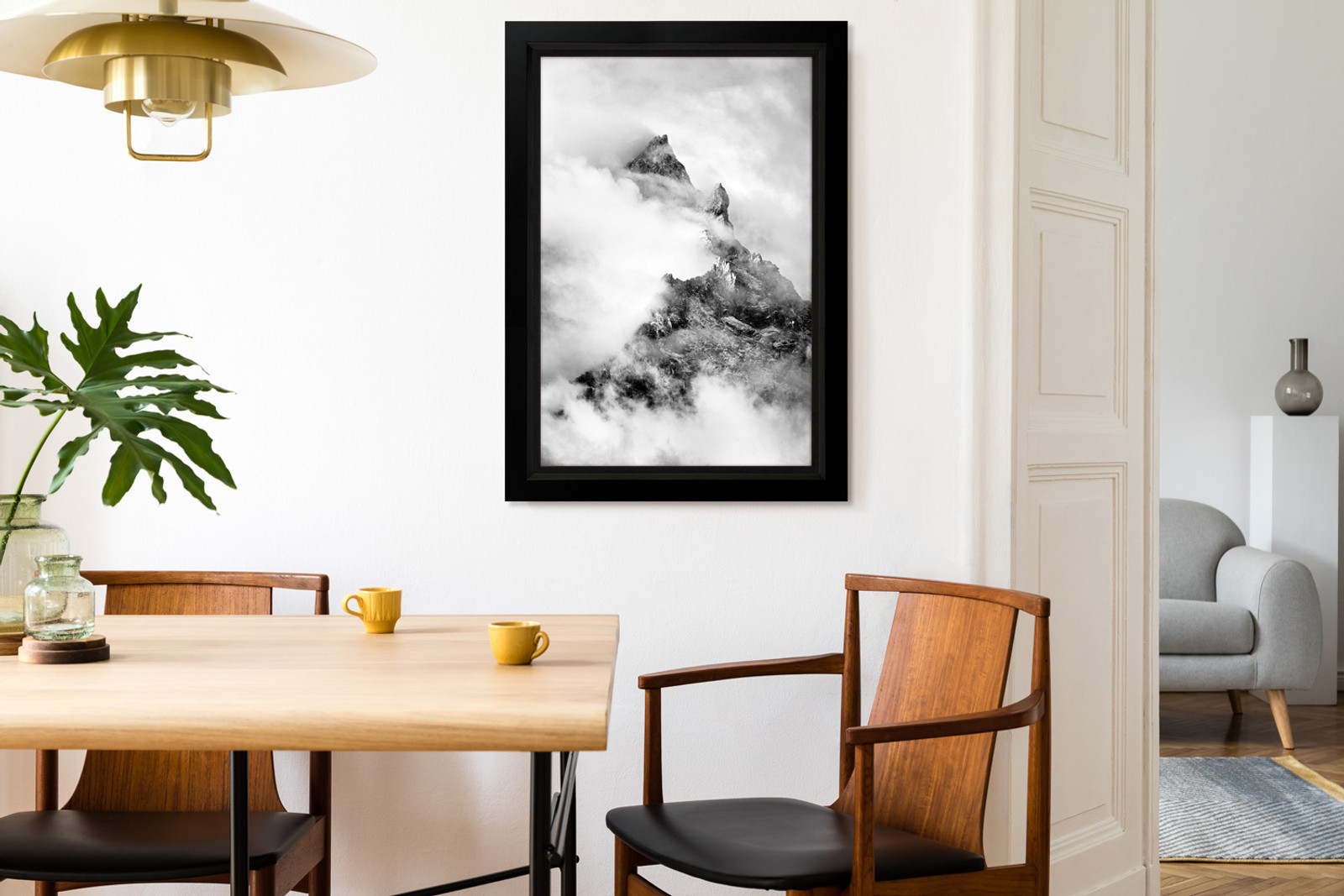 Atmospheric mountain photography print in a contemporary room setting