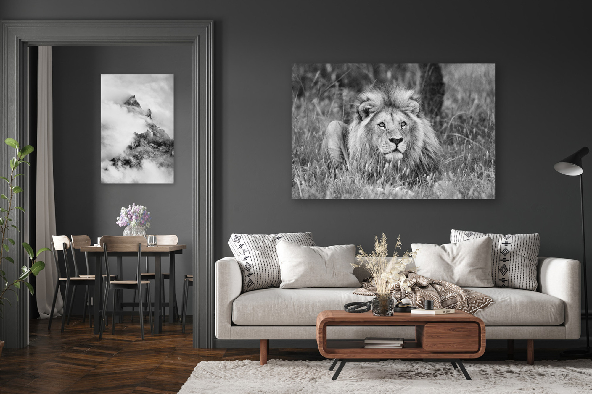 Canvas Wrapped Print of “Signals from the Sky” by Thomas D. Mangelsen hanging on a deep gray wall above an ivory sofa; modern wildlife photography wall art for the living room with a bold black and white lion portrait.