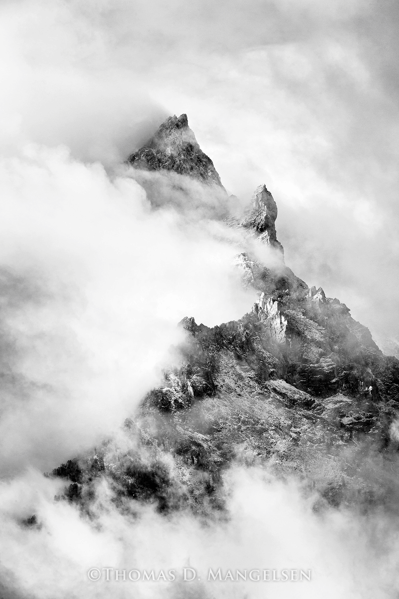 Fine art print for sale featuring Teewinot Peak under dramatic skies