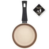Cream non-stick frying pan with black handle, viewed from above