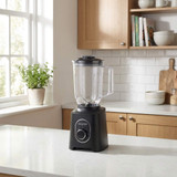 Black jug blender with clear pitcher on kitchen counter