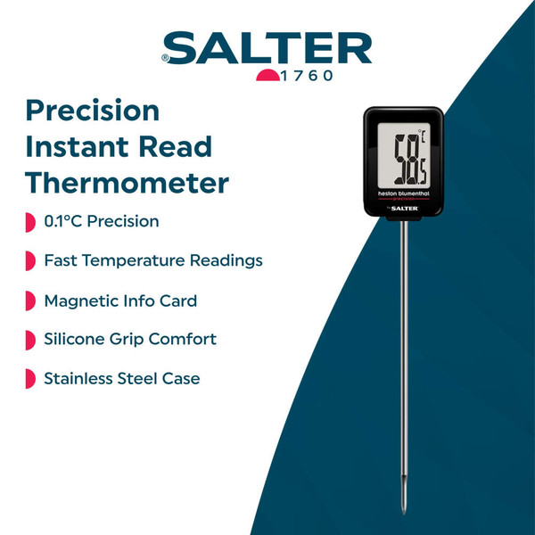 Digital meat thermometer measuring temperature in cooked steak on wooden board