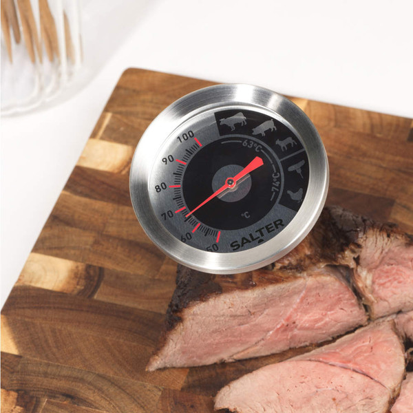 Salter meat thermometer with stainless steel dial on table, Christmas sweets in background