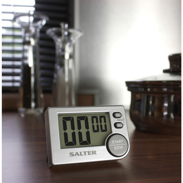 Digital kitchen timer with large display, silver finish, shown on countertop.