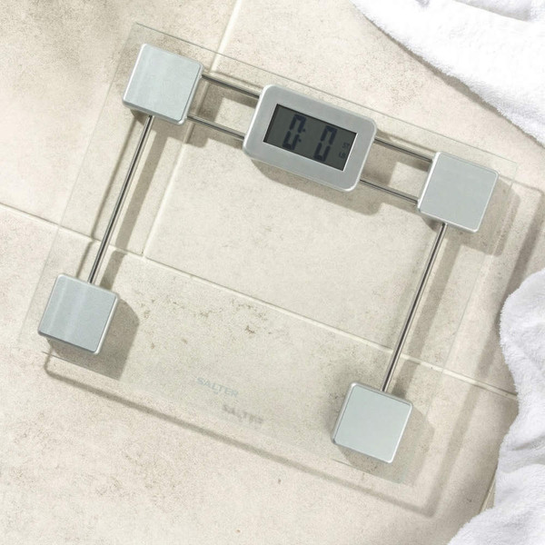 Square glass digital bathroom scale with silver accents, 30cm by 30cm.