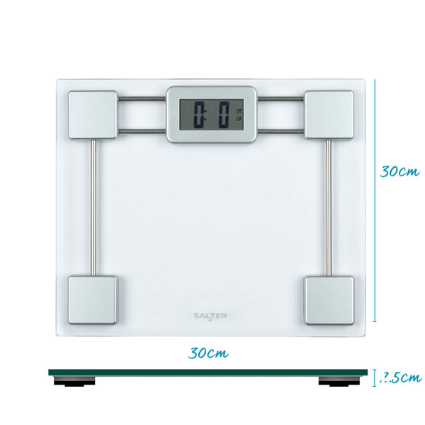 Glass digital bathroom scale with silver accents on tiled floor