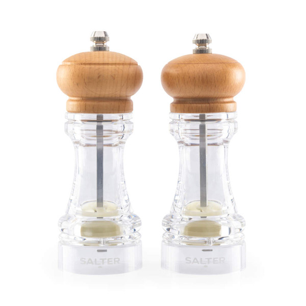Pair of clear acrylic and wood salt and pepper mills on white background