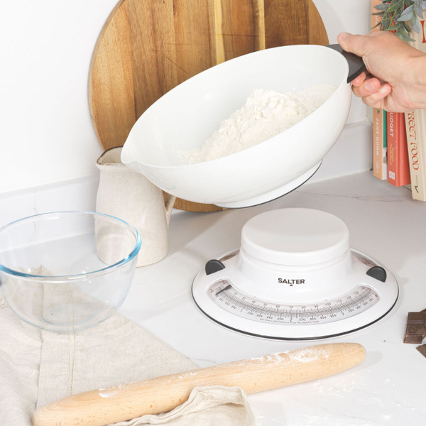 White Salter mechanical kitchen scale with bowl, close-up on dial