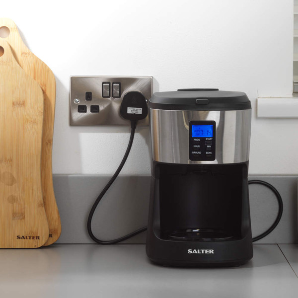 Bean-to-cup filter coffee machine with glass jug, shown with fresh coffee beans and drinks.