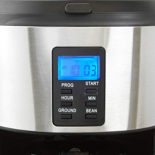 Black and silver filter coffee machine with glass jug in modern kitchen setting