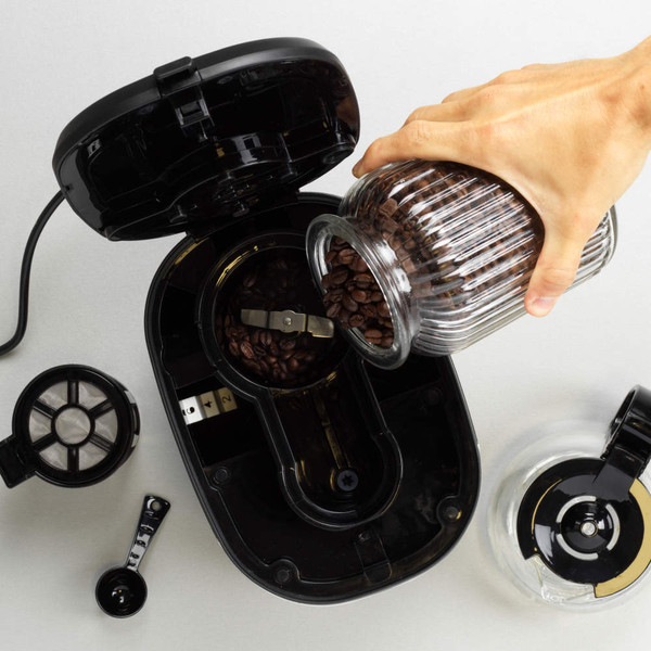 Close-up of digital display and buttons on a stainless steel filter coffee machine