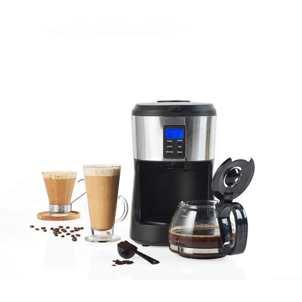 Black and silver filter coffee machine with glass jug, two cups of coffee, and coffee beans